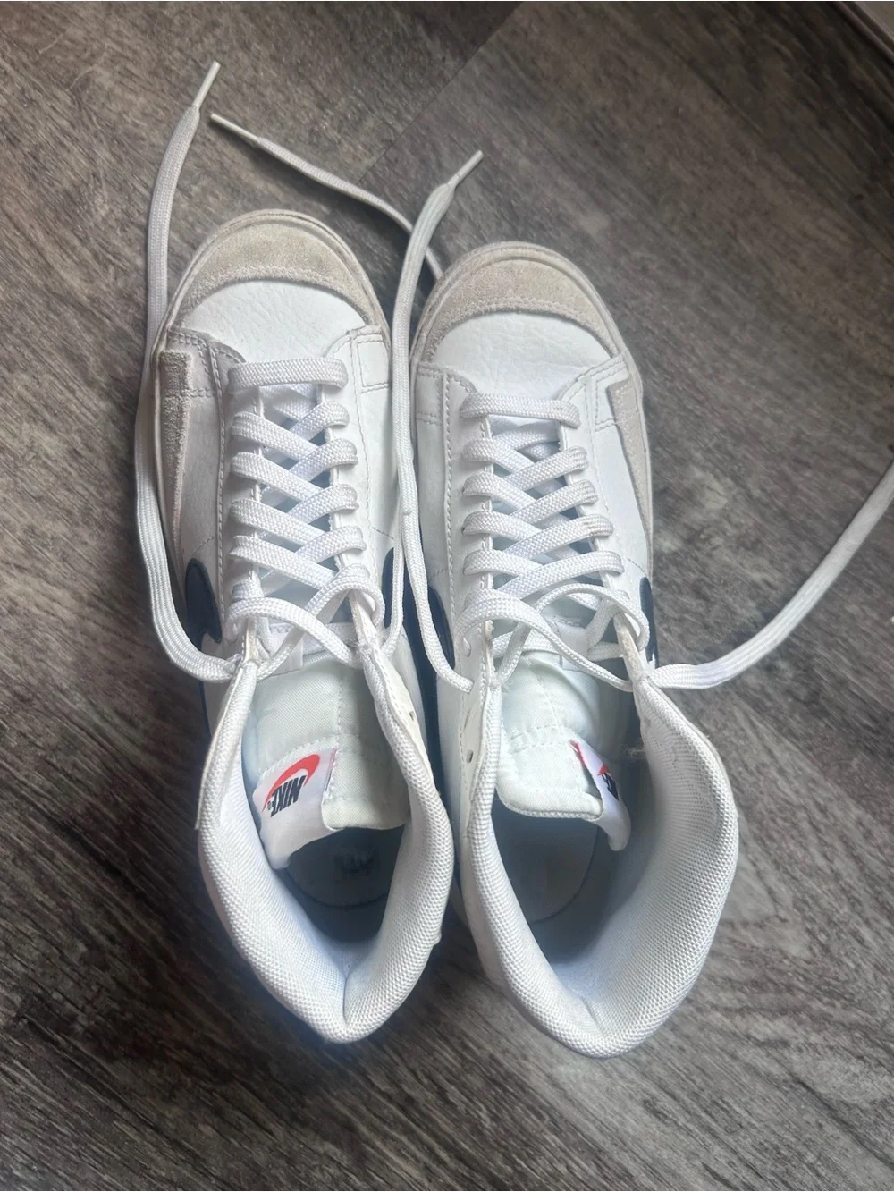Nike White High-Top Sneakers with Black Swoosh and Pink Tongue Logo